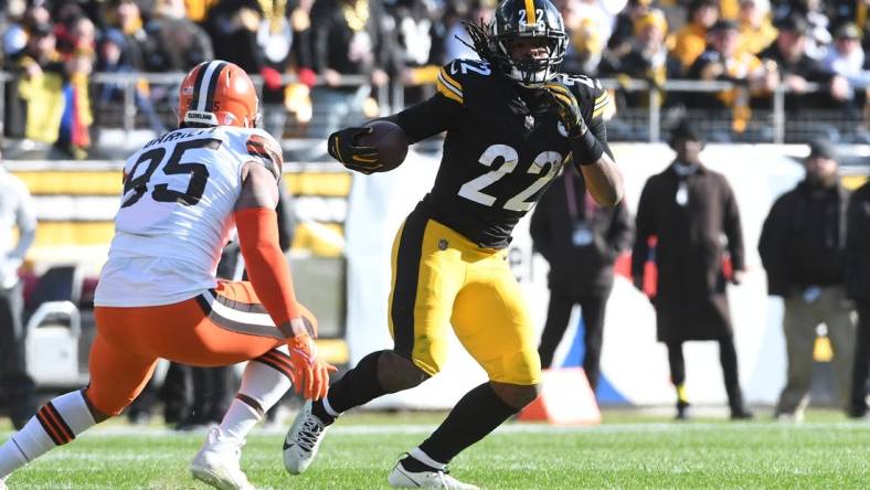 Jan 8, 2023; Pittsburgh, Pennsylvania, USA;  Pittsburgh Steelers runninmg back Najee Harris (22) runs from Cleveland Browns defensive end Myles Garrett (95) during the first quarter at Acrisure Stadium. Mandatory Credit: Philip G. Pavely-USA TODAY Sports