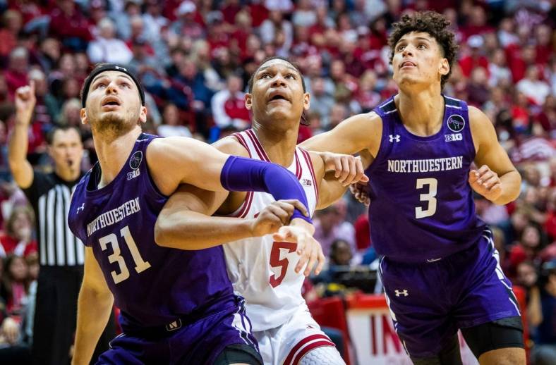 Indiana's Malik Reneau (5) battles with Northwestern's Robbie Baran (31) and Ty Berry (3) during the second half of the Indiana versus Northwestern men's basketball game at Simon Skjodt Assembly Hall on Sunday, Jan. 8, 2023.

Iu Nw Bb 2h Reneau 2