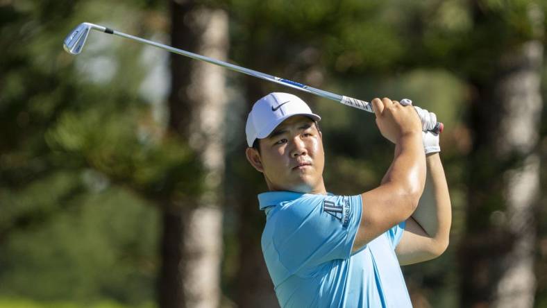 January 8, 2023; Maui, Hawaii, USA; Tom Kim hits his tee shot on the second hole during the final round of the Sentry Tournament of Champions golf tournament at Kapalua Resort - The Plantation Course. Mandatory Credit: Kyle Terada-USA TODAY Sports