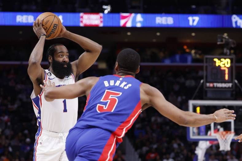 Jan 8, 2023; Detroit, Michigan, USA;  Philadelphia 76ers guard James Harden (1) is defended by Detroit Pistons guard Alec Burks (5) in the first half at Little Caesars Arena. Mandatory Credit: Rick Osentoski-USA TODAY Sports