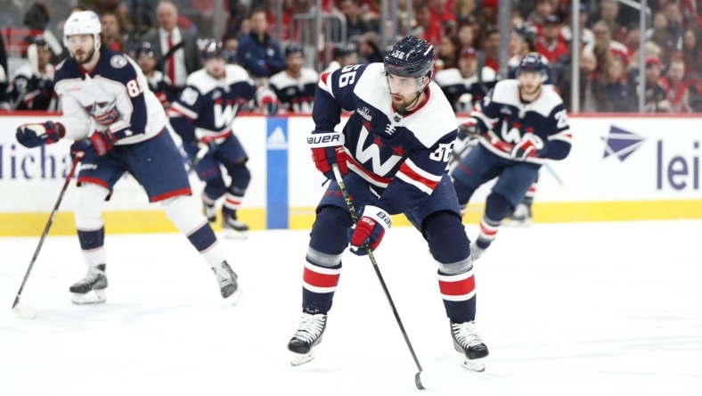 Jan 8, 2023; Washington, District of Columbia, USA; Washington Capitals defenseman Erik Gustafsson (56) skates with the puck against the Columbus Blue Jackets during the first period at Capital One Arena. Mandatory Credit: Amber Searls-USA TODAY Sports
