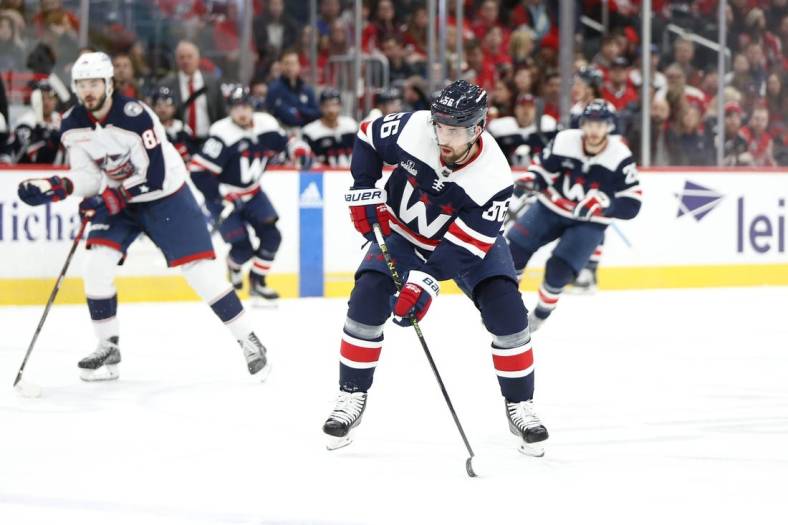 Jan 8, 2023; Washington, District of Columbia, USA; Washington Capitals defenseman Erik Gustafsson (56) skates with the puck against the Columbus Blue Jackets during the first period at Capital One Arena. Mandatory Credit: Amber Searls-USA TODAY Sports