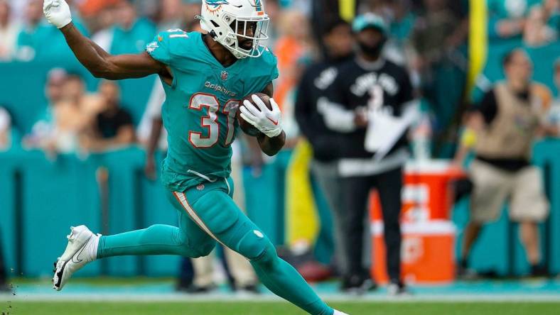 Miami Dolphins running back Raheem Mostert (31), in action against the New York Jets during NFL action Sunday January 08, 2023 at Hard Rock Stadium in Miami Gardens.