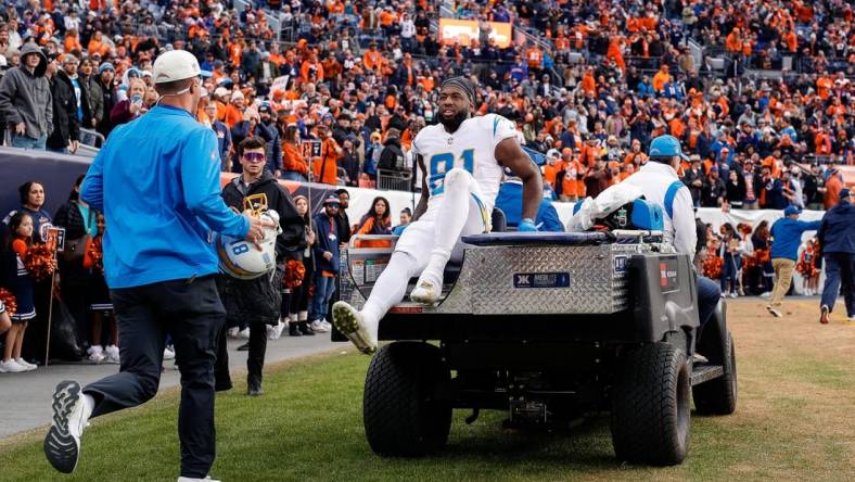 Jan 8, 2023; Denver, Colorado, USA; Los Angeles Chargers wide receiver Mike Williams (81) is carted off the field in the second quarter against the Denver Broncos at Empower Field at Mile High. Mandatory Credit: Isaiah J. Downing-USA TODAY Sports