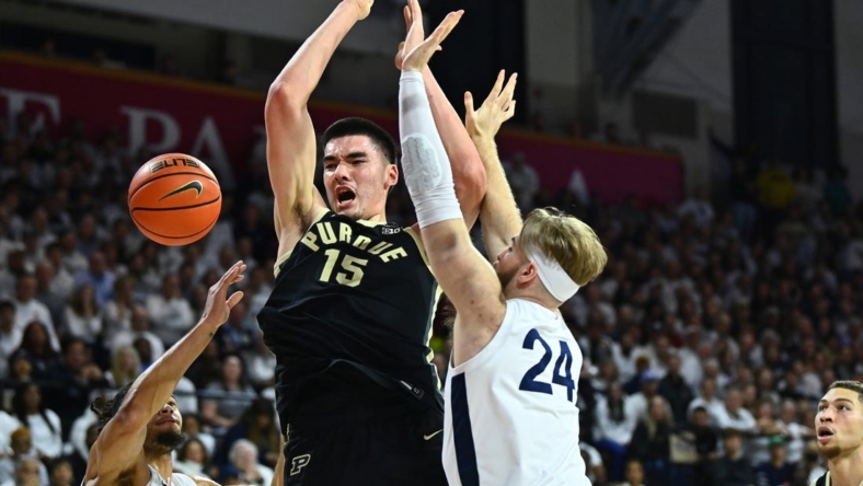 Jan 8, 2023; Philadelphia, Pennsylvania, USA; Purdue Boilermakers center Zach Edey (15) loses control of the ball against Penn State Nittany Lions forward Michael Henn (24) in the first half at The Palestra. Mandatory Credit: Kyle Ross-USA TODAY Sports