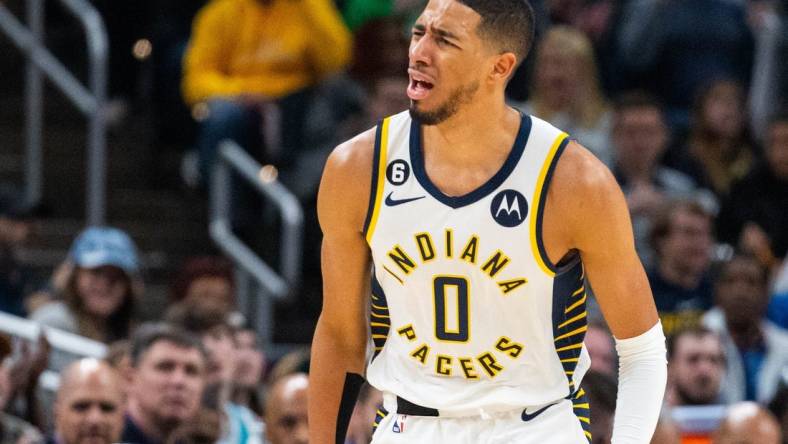 Jan 8, 2023; Indianapolis, Indiana, USA; Indiana Pacers guard Tyrese Haliburton (0) reacts to a made basket in the second half  against the Charlotte Hornets at Gainbridge Fieldhouse. Mandatory Credit: Trevor Ruszkowski-USA TODAY Sports