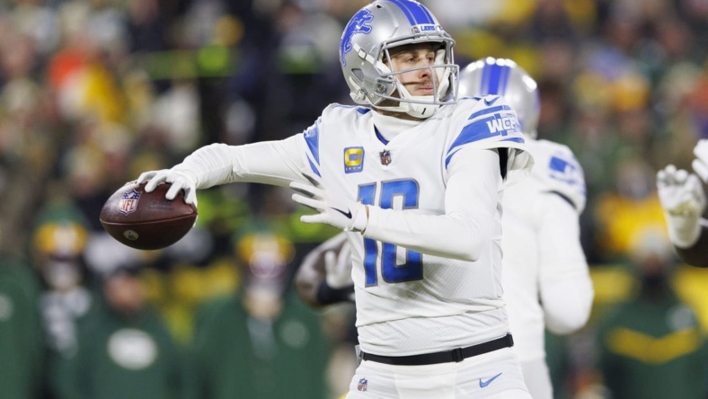 Jan 8, 2023; Green Bay, Wisconsin, USA;  Detroit Lions quarterback Jared Goff (16) throws a pass during the first quarter against the Green Bay Packers at Lambeau Field. Mandatory Credit: Jeff Hanisch-USA TODAY Sports