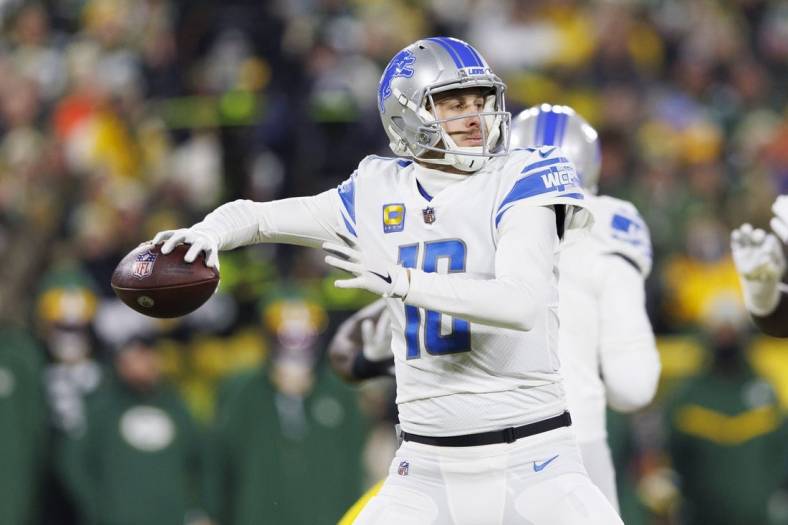 Jan 8, 2023; Green Bay, Wisconsin, USA;  Detroit Lions quarterback Jared Goff (16) throws a pass during the first quarter against the Green Bay Packers at Lambeau Field. Mandatory Credit: Jeff Hanisch-USA TODAY Sports