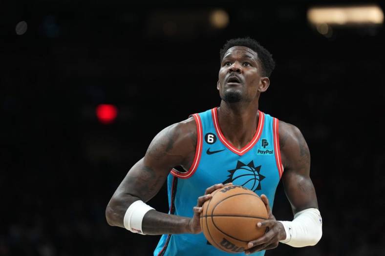 Jan 8, 2023; Phoenix, Arizona, USA; Phoenix Suns center Deandre Ayton (22) shoots a free throw against the Cleveland Cavaliers during the first half at Footprint Center. Mandatory Credit: Joe Camporeale-USA TODAY Sports