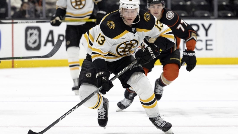 Jan 8, 2023; Anaheim, California, USA; Boston Bruins center Charlie Coyle (13) skates with the puck during the third period against the Anaheim Ducks at Honda Center. Mandatory Credit: Jason Parkhurst-USA TODAY Sports