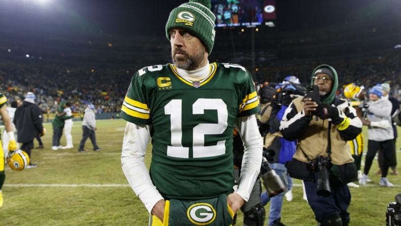 Jan 8, 2023; Green Bay, Wisconsin, USA;  Green Bay Packers quarterback Aaron Rodgers (12) walks off the field following the game against the Detroit Lions at Lambeau Field. Mandatory Credit: Jeff Hanisch-USA TODAY Sports