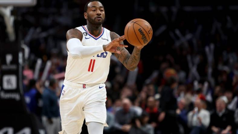 Jan 8, 2023; Los Angeles, California, USA;  Los Angeles Clippers guard John Wall (11) passes the ball during the fourth quarter against the Atlanta Hawks at Crypto.com Arena. Mandatory Credit: Kiyoshi Mio-USA TODAY Sports