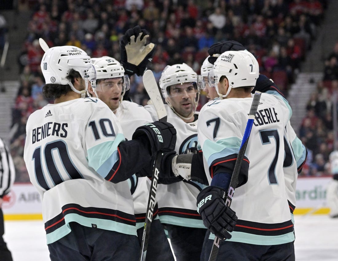 Jan 9, 2023; Montreal, Quebec, CAN; Seattle Kraken forward Daniel Sprong (91) celebrates with teammates including forward Matty Beniers (10) and forward Jordan Eberle (7)  after scoring a goal against the Montreal Canadiens during the first period at the Bell Centre. Mandatory Credit: Eric Bolte-USA TODAY Sports