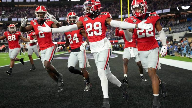 Jan 9, 2023; Inglewood, CA, USA; Georgia Bulldogs defensive back Christopher Smith (29) celebrates after defensive back Javon Bullard (22) made an interception against the TCU Horned Frogs during the second quarter of the CFP national championship game at SoFi Stadium. Mandatory Credit: Kirby Lee-USA TODAY Sports