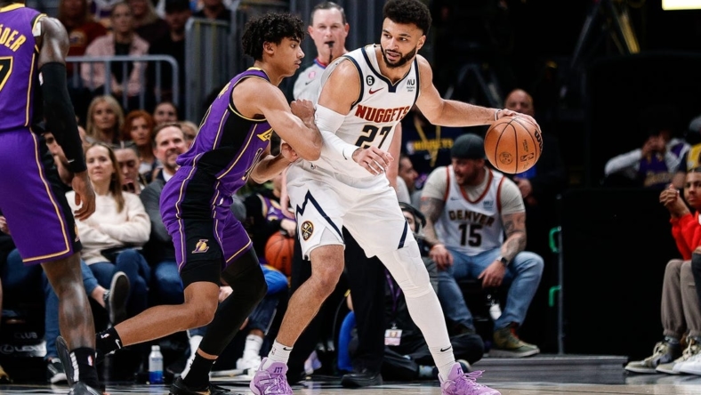 Jan 9, 2023; Denver, Colorado, USA; Denver Nuggets guard Jamal Murray (27) controls the ball as Los Angeles Lakers guard Max Christie (10) guards in the second quarter at Ball Arena. Mandatory Credit: Isaiah J. Downing-USA TODAY Sports