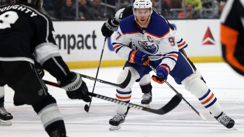 Jan 9, 2023; Los Angeles, California, USA; Edmonton Oilers center Connor McDavid (97) controls the puck during the third period against the Los Angeles Kings at Crypto.com Arena. Mandatory Credit: Jason Parkhurst-USA TODAY Sports