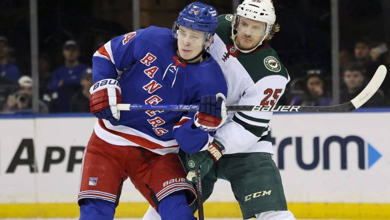 Jan 10, 2023; New York, New York, USA; New York Rangers right wing Kaapo Kakko (24) and Minnesota Wild defenseman Jonas Brodin (25) watch the play during the first period at Madison Square Garden. Mandatory Credit: Jessica Alcheh-USA TODAY Sports