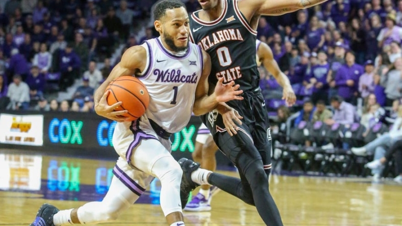 Jan 10, 2023; Manhattan, Kansas, USA; Kansas State Wildcats guard Markquis Nowell (1) drives to the basket against Oklahoma State Cowboys guard Avery Anderson III (0) during the first half at Bramlage Coliseum. Mandatory Credit: Scott Sewell-USA TODAY Sports