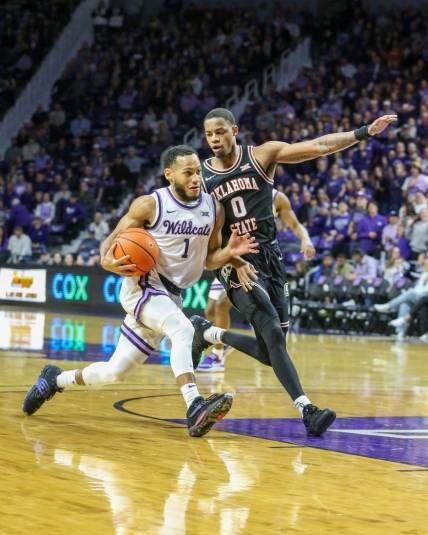 Jan 10, 2023; Manhattan, Kansas, USA; Kansas State Wildcats guard Markquis Nowell (1) drives to the basket against Oklahoma State Cowboys guard Avery Anderson III (0) during the first half at Bramlage Coliseum. Mandatory Credit: Scott Sewell-USA TODAY Sports