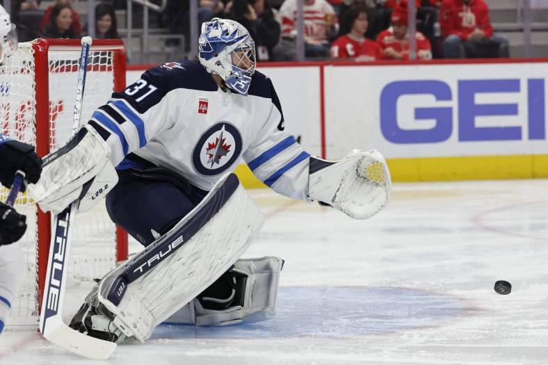 Jan 10, 2023; Detroit, Michigan, USA;  Winnipeg Jets goaltender Connor Hellebuyck (37) makes the save in the second period against the Detroit Red Wings at Little Caesars Arena. Mandatory Credit: Rick Osentoski-USA TODAY Sports