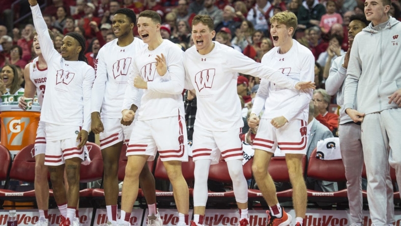 Jan 10, 2023; Madison, Wisconsin, USA;  The Wisconsin Badgers bench celebrates a three-pointer by Wisconsin Badgers forward Steven Crowl (not pictured) during the second half against the Michigan State Spartans at the Kohl Center. Mandatory Credit: Kayla Wolf-USA TODAY Sports