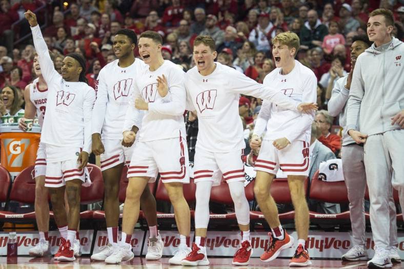 Jan 10, 2023; Madison, Wisconsin, USA;  The Wisconsin Badgers bench celebrates a three-pointer by Wisconsin Badgers forward Steven Crowl (not pictured) during the second half against the Michigan State Spartans at the Kohl Center. Mandatory Credit: Kayla Wolf-USA TODAY Sports