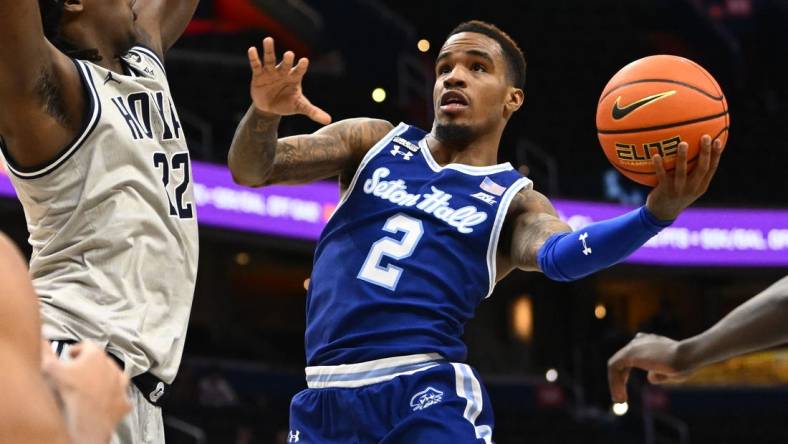 Jan 10, 2023; Washington, District of Columbia, USA; Seton Hall Pirates guard Al-Amir Dawes (2) shoots as Georgetown Hoyas forward Bradley Ezewiro (22) defends during the first half at Capital One Arena. Mandatory Credit: Brad Mills-USA TODAY Sports