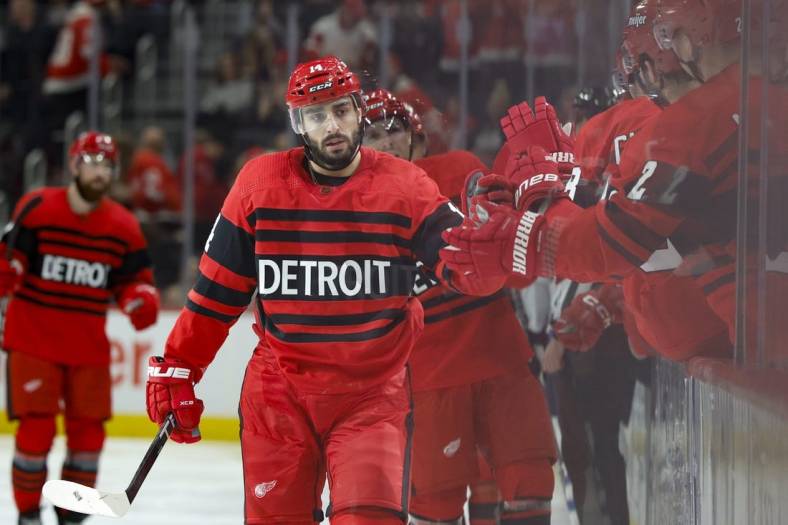 Jan 10, 2023; Detroit, Michigan, USA;  Detroit Red Wings center Robby Fabbri (14) receives congratulations from teammates after scoring in the third period against the Winnipeg Jets at Little Caesars Arena. Mandatory Credit: Rick Osentoski-USA TODAY Sports