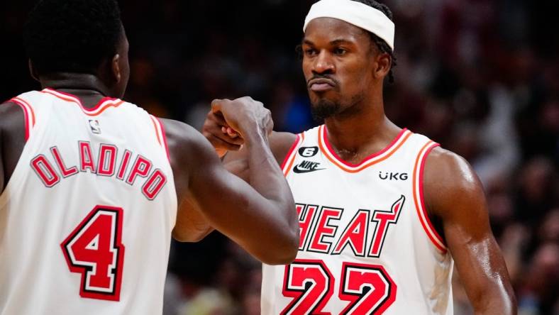 Jan 10, 2023; Miami, Florida, USA; Miami Heat forward Jimmy Butler (22) celebrates with guard Victor Oladipo (4) after scoring against the Oklahoma City Thunder during the fourth quarter at FTX Arena. Mandatory Credit: Rich Storry-USA TODAY Sports