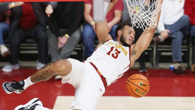 Iowa State University Cyclones guard Jaren Holmes (13) hangs out the rim after a dunk against Texas Tech Red Raiders during the second half at Hilton Coliseum Tuesday, Jan 10, 2023, in Ames, Iowa.  Photo by Nirmalendu Majumdar/Ames Tribune

Trxas Tech And Iowa State Men S Basketball