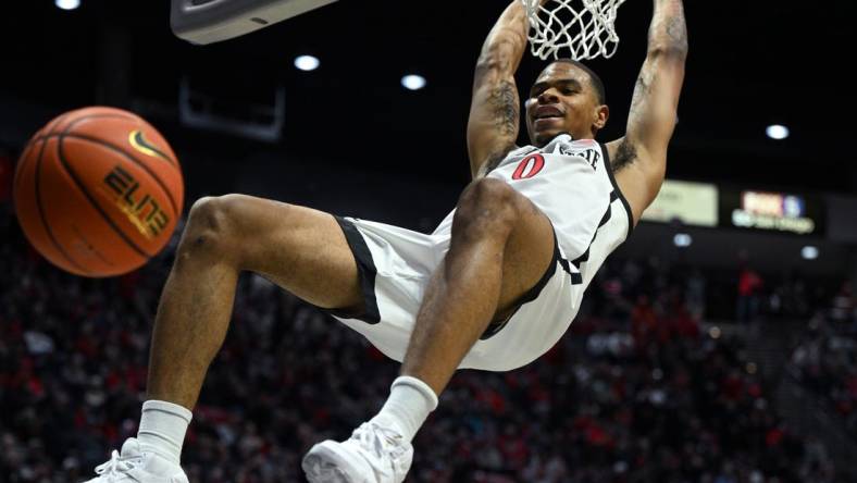 Jan 10, 2023; San Diego, California, USA; San Diego State Aztecs forward Keshad Johnson (0) dunks the ball during the first half against the Nevada Wolf Pack at Viejas Arena. Mandatory Credit: Orlando Ramirez-USA TODAY Sports