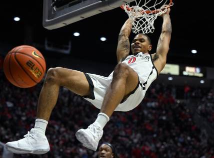 Jan 10, 2023; San Diego, California, USA; San Diego State Aztecs forward Keshad Johnson (0) dunks the ball during the first half against the Nevada Wolf Pack at Viejas Arena. Mandatory Credit: Orlando Ramirez-USA TODAY Sports