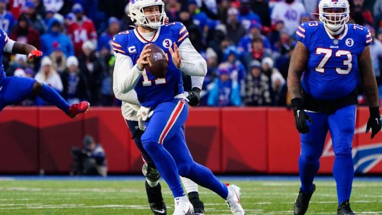 Jan 8, 2023; Orchard Park, New York, USA; Buffalo Bills quarterback Josh Allen (17) against the New England Patriots during the second half at Highmark Stadium. Mandatory Credit: Gregory Fisher-USA TODAY Sports