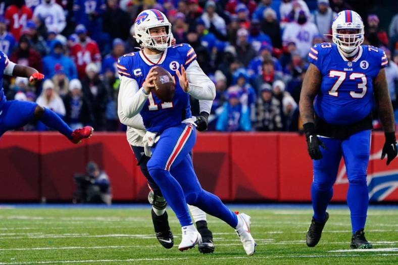 Jan 8, 2023; Orchard Park, New York, USA; Buffalo Bills quarterback Josh Allen (17) against the New England Patriots during the second half at Highmark Stadium. Mandatory Credit: Gregory Fisher-USA TODAY Sports