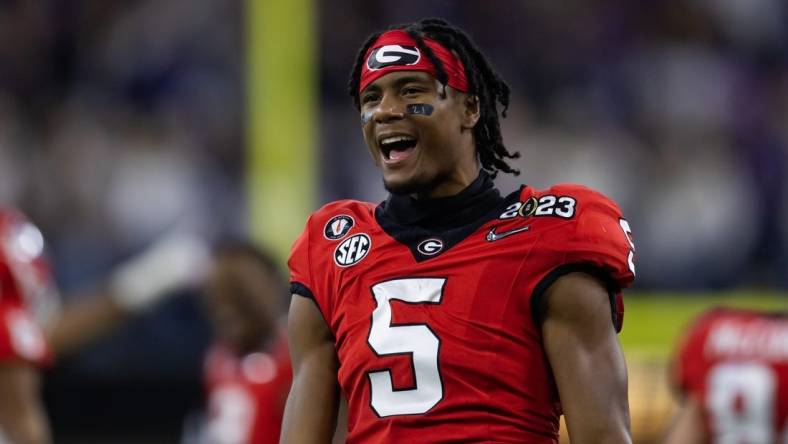 Jan 9, 2023; Inglewood, CA, USA; Georgia Bulldogs wide receiver Adonai Mitchell (5) celebrates against the TCU Horned Frogs during the CFP national championship game at SoFi Stadium. Mandatory Credit: Mark J. Rebilas-USA TODAY Sports