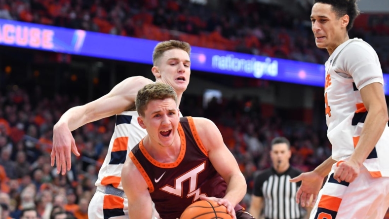 Jan 11, 2023; Syracuse, New York, USA; Virginia Tech Hokies guard Sean Pedulla (3) reacts to a foul by Syracuse Orange guard Justin Taylor (behind) in the first half at JMA Wireless Dome. Mandatory Credit: Mark Konezny-USA TODAY Sports