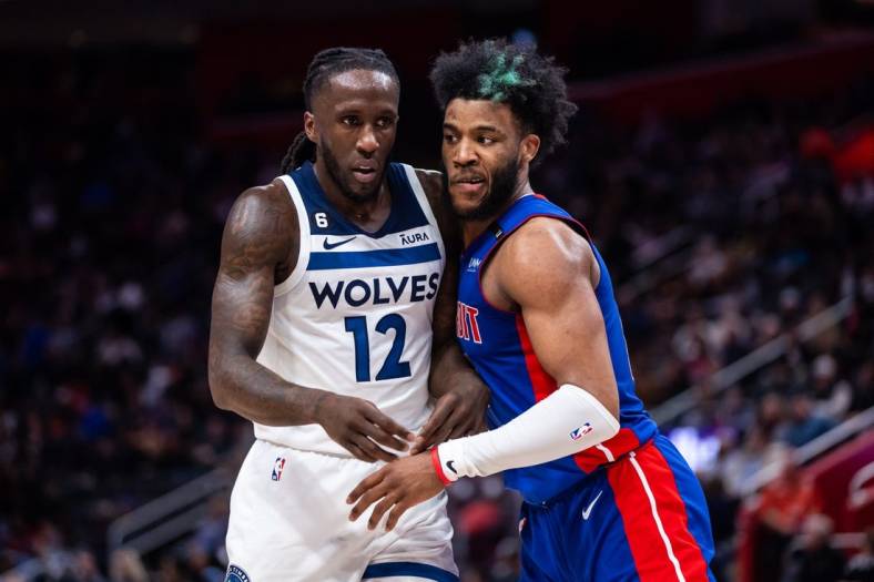 Jan 11, 2023; Detroit, Michigan, USA; Minnesota Timberwolves forward Taurean Prince (12) and Detroit Pistons forward Saddiq Bey (41) battle for position before the ball is inbounded in the second quarter at Little Caesars Arena. Mandatory Credit: Allison Farrand-USA TODAY Sports