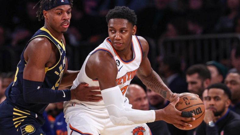Jan 11, 2023; New York, New York, USA; New York Knicks guard RJ Barrett (9) shields the ball from Indiana Pacers guard Buddy Hield (24) during the second quarter at Madison Square Garden. Mandatory Credit: Vincent Carchietta-USA TODAY Sports