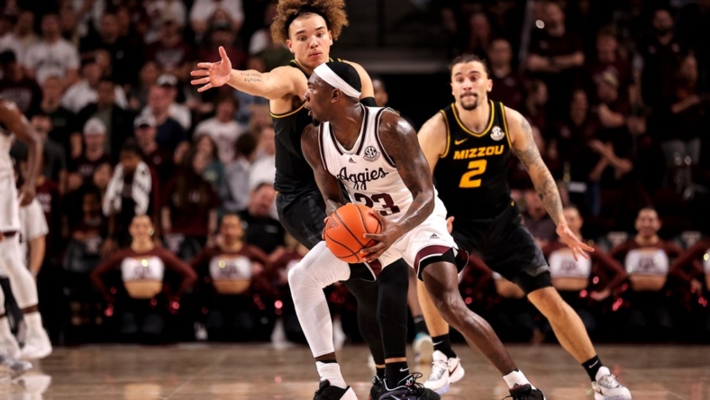 Jan 11, 2023; College Station, Texas, USA; Texas A&M Aggies guard Tyrece Radford (23) looks to pass the ball while Missouri Tigers forward Noah Carter (35) defends during the first half at Reed Arena. Mandatory Credit: Erik Williams-USA TODAY Sports