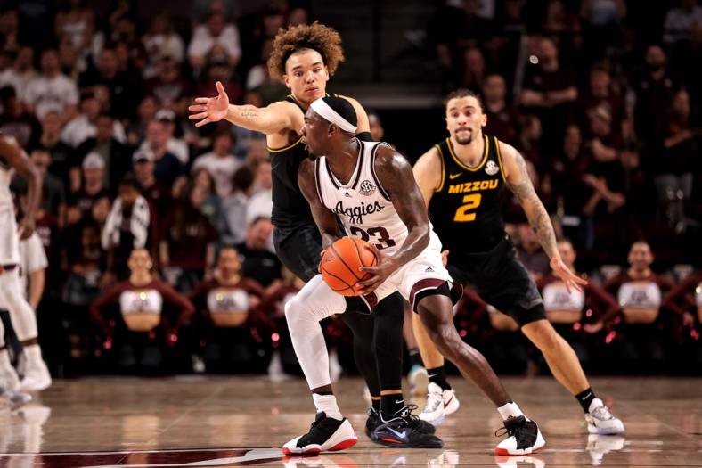 Jan 11, 2023; College Station, Texas, USA; Texas A&M Aggies guard Tyrece Radford (23) looks to pass the ball while Missouri Tigers forward Noah Carter (35) defends during the first half at Reed Arena. Mandatory Credit: Erik Williams-USA TODAY Sports