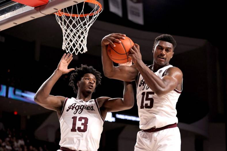 Jan 11, 2023; College Station, Texas, USA; Texas A&M Aggies forward Henry Coleman III (15) grabs a rebound away from forward Solomon Washington (13) against the Missouri Tigers during the first half at Reed Arena. Mandatory Credit: Erik Williams-USA TODAY Sports