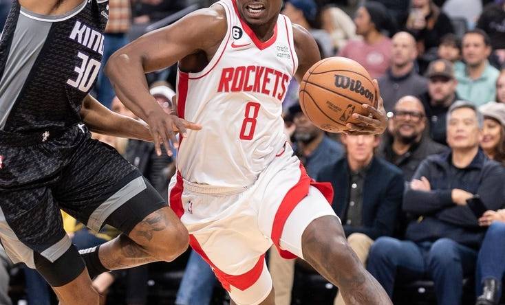 Jan 11, 2023; Sacramento, California, USA; Houston Rockets forward Jae'Sean Tate (8) drives to the basket against Sacramento Kings forward KZ Okpala (30) during the first quarter at Golden 1 Center. Mandatory Credit: Ed Szczepanski-USA TODAY Sports