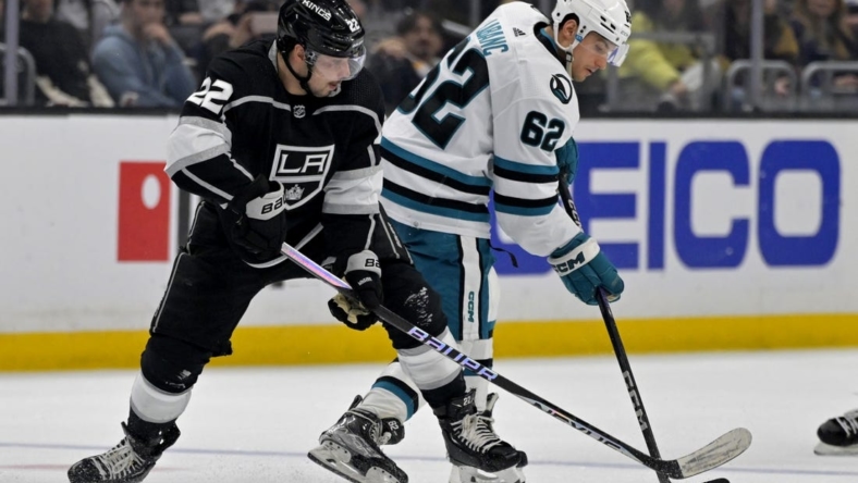 Jan 11, 2023; Los Angeles, California, USA; San Jose Sharks right wing Kevin Labanc (62) controls the puck away from Los Angeles Kings left wing Kevin Fiala (22) in the second half at Crypto.com Arena. Mandatory Credit: Jayne Kamin-Oncea-USA TODAY Sports
