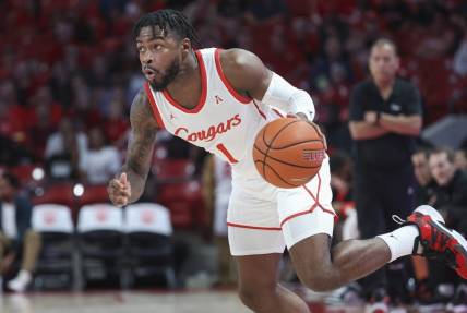 Jan 11, 2023; Houston, Texas, USA; Houston Cougars guard Jamal Shead (1) in action during the game against the South Florida Bulls at Fertitta Center. Mandatory Credit: Troy Taormina-USA TODAY Sports