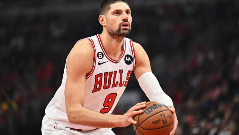 Jan 7, 2023; Chicago, Illinois, USA;  Chicago Bulls center Nikola Vucevic (9) controls the ball against the Utah Jazz at United Center. Mandatory Credit: Jamie Sabau-USA TODAY Sports