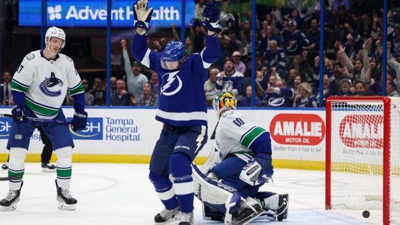 Jan 12, 2023; Tampa, Florida, USA;  Tampa Bay Lightning right wing Corey Perry (10) scores a goal against the Vancouver Canucks in the first period at Amalie Arena. Mandatory Credit: Nathan Ray Seebeck-USA TODAY Sports