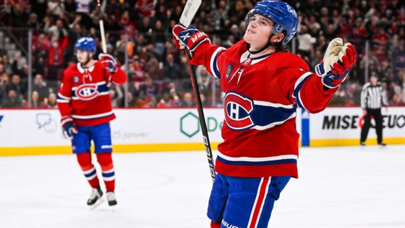 Jan 12, 2023; Montreal, Quebec, CAN; Montreal Canadiens right wing Cole Caufield (22) celebrates his goal against the Nashville Predators during the second period at Bell Centre. Mandatory Credit: David Kirouac-USA TODAY Sports