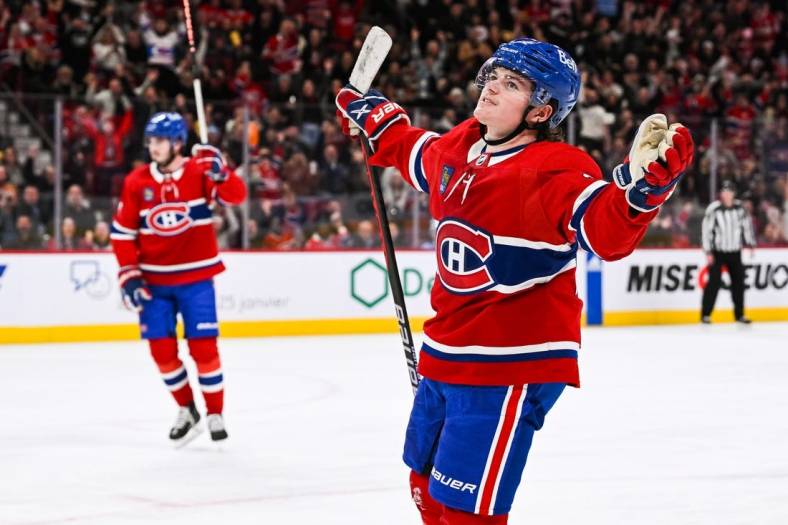 Jan 12, 2023; Montreal, Quebec, CAN; Montreal Canadiens right wing Cole Caufield (22) celebrates his goal against the Nashville Predators during the second period at Bell Centre. Mandatory Credit: David Kirouac-USA TODAY Sports