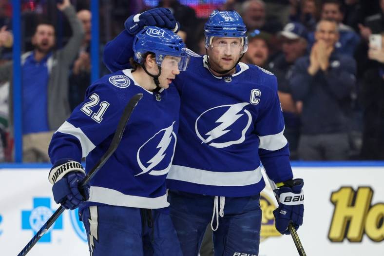 Jan 12, 2023; Tampa, Florida, USA;  Tampa Bay Lightning center Brayden Point (21) congratulates center Steven Stamkos (91) after scoring a goal against the Vancouver Canucks in the third period at Amalie Arena. Mandatory Credit: Nathan Ray Seebeck-USA TODAY Sports