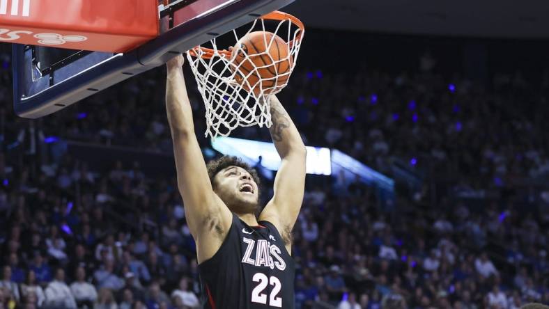 Jan 12, 2023; Provo, Utah, USA; Gonzaga Bulldogs forward Anton Watson (22) dunks the ball against the Brigham Young Cougars in the first half at Marriott Center. Mandatory Credit: Rob Gray-USA TODAY Sports